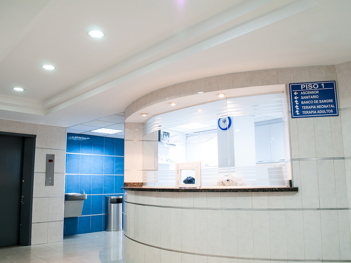 Bright, modern hospital corridor suggesting calm clinical operations