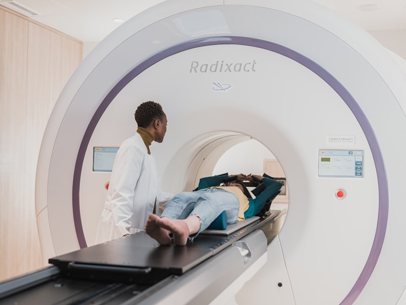 Radiation oncologist and physicist reviewing treatment data together at a workstation