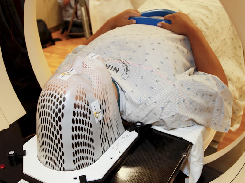 Patient fitted with an immobilization mask for precise head and neck radiation therapy