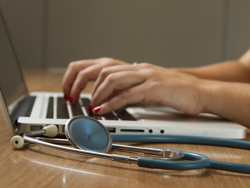 Hospital administrator reviewing operational reports on a tablet in a clinical setting